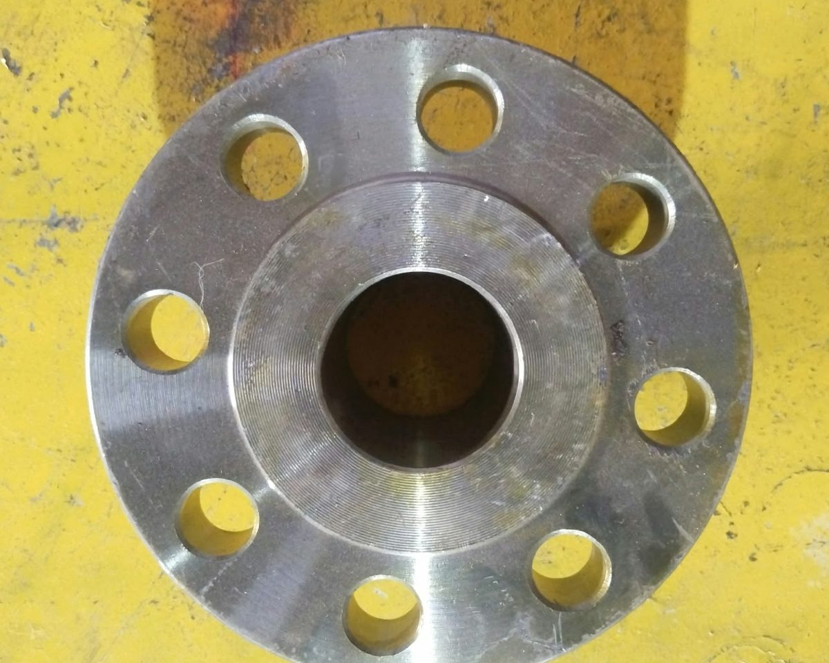 Raised face flange with eight bolt holes, photographed at the RIC works