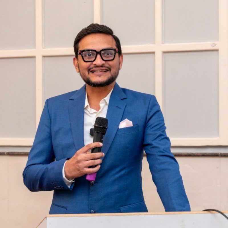 Vikas Doshi, CEO of Rajendra Industrial Corporation, speaking at a lectern