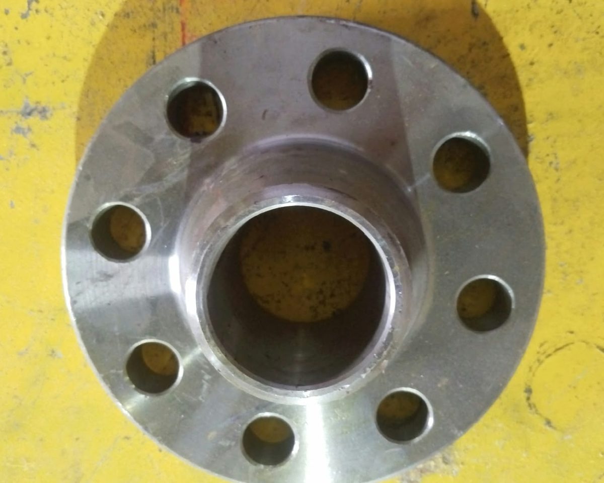 Weld neck flange with eight bolt holes, seen from the hub side, at the RIC works